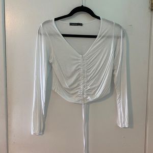 White long sleeve cropped top, drawstring at front
